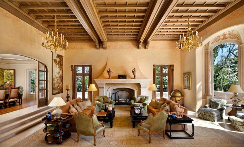 Mediterranean style sunken living room with decorative wood ceiling