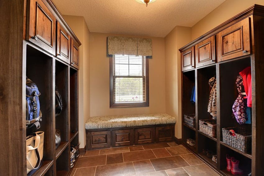 Mudroom with wood cabinetry bench and cubbies