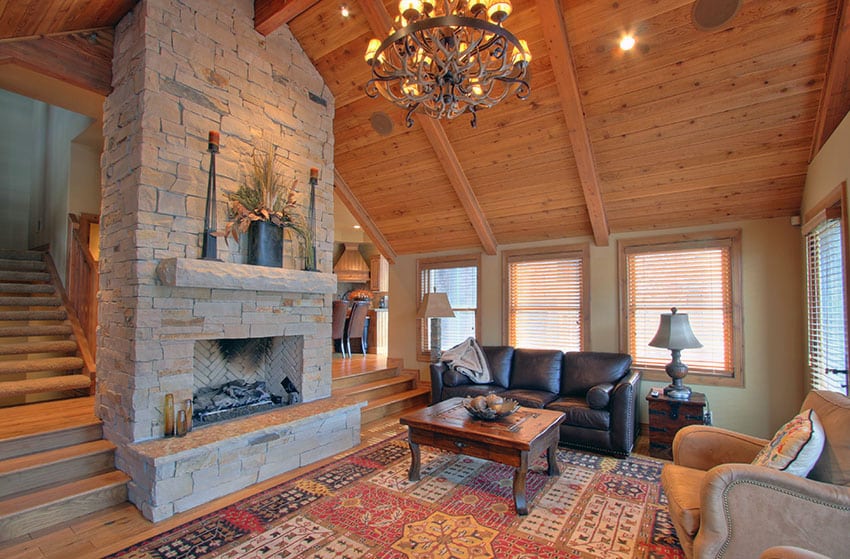 Rustic sunken living room with wood flooring and fireplace
