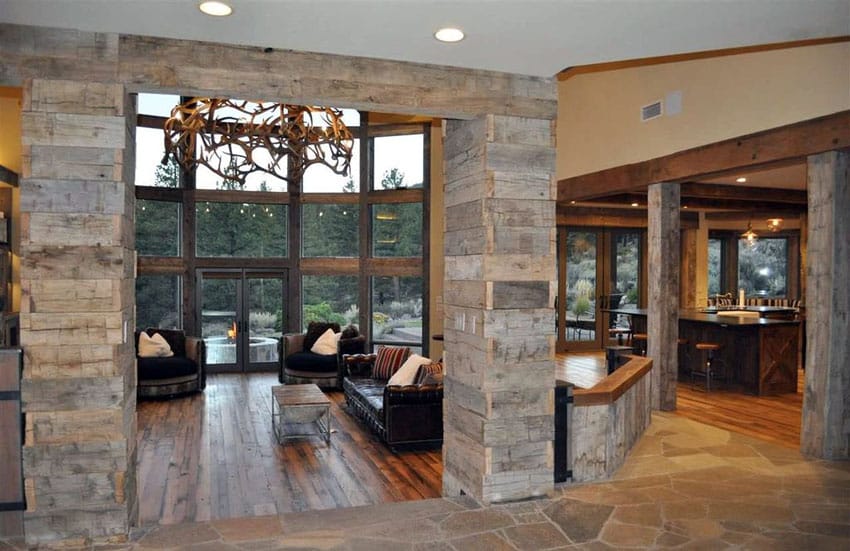 Rustic wood sunken living room with large glass windows view