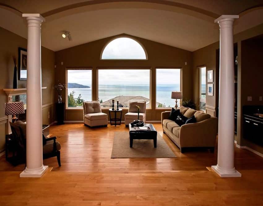 Sunken living room with light wood floors and amazing ocean views