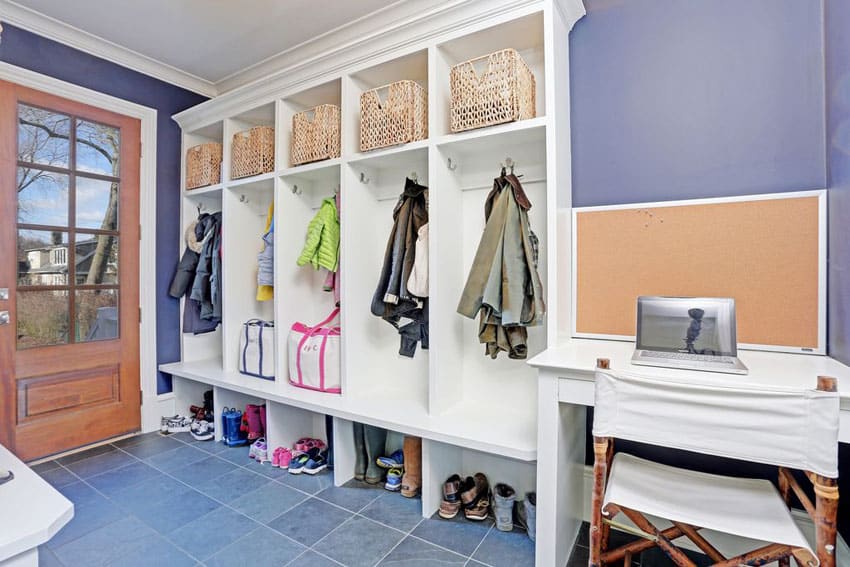 Traditional style mudroom with kids cubbies baskets and clothing hangers
