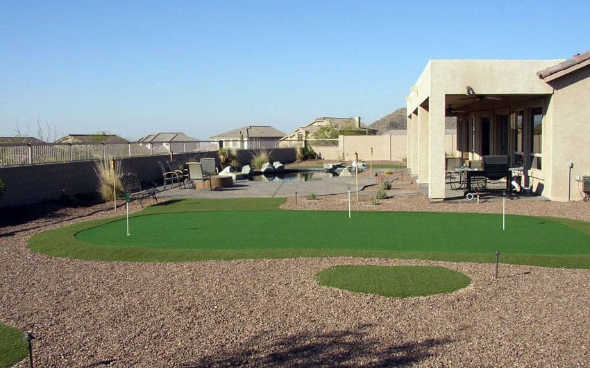 Backyard putting green with desert style landscaping
