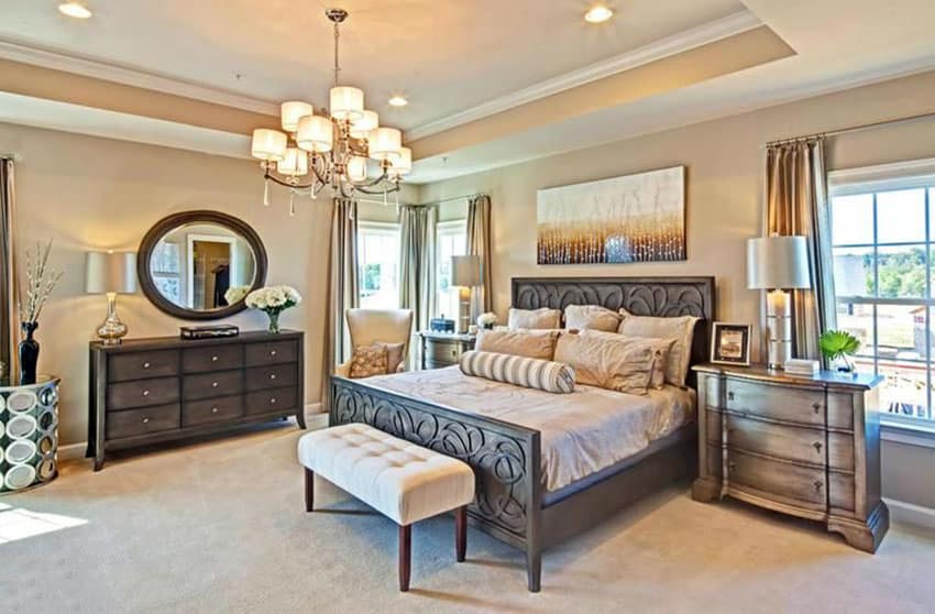 Beautiful tan bedroom with panel bed and wood furniture