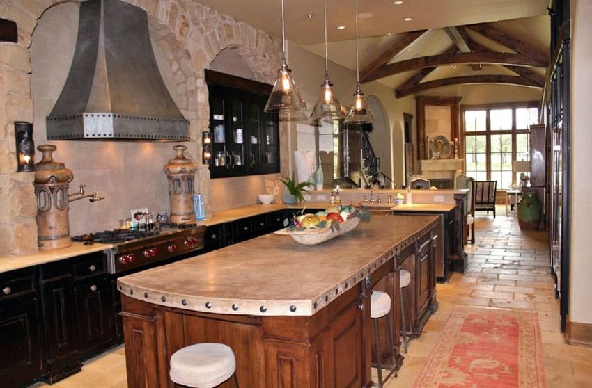 Tuscan kitchen with arched ceilings, brick walls and travertine floors
