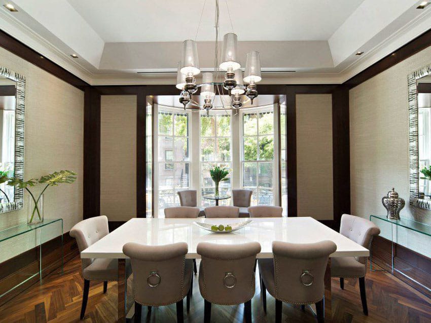 Beige and mahogany color dining room with wood parquet floors