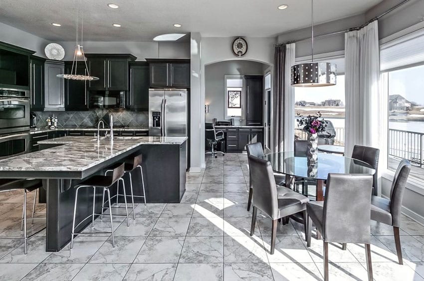 Kitchen with open concept to dining area with t-shaped island