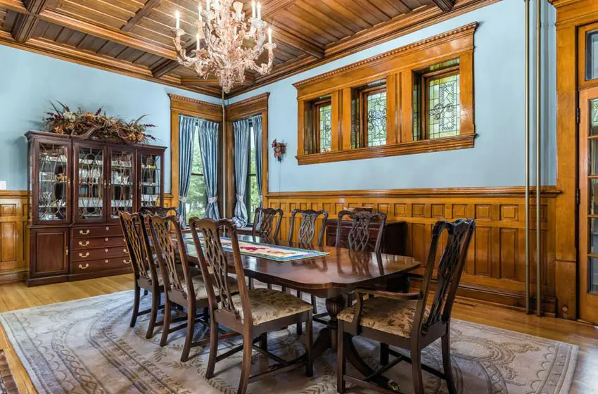 Blue painted craftsman dining room with wood wainscoting