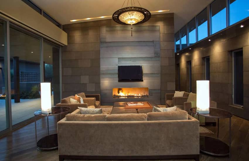 Brown contemporary living room with slanted roof and fireplace