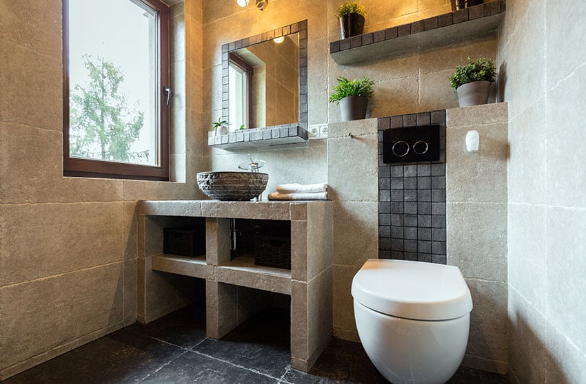 Compact bathroom with built in concrete sink vanity and shelving