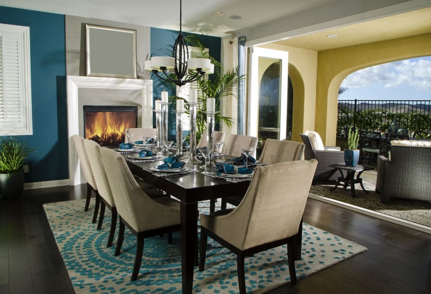 Contemporary dining room with blue paint and outdoor views