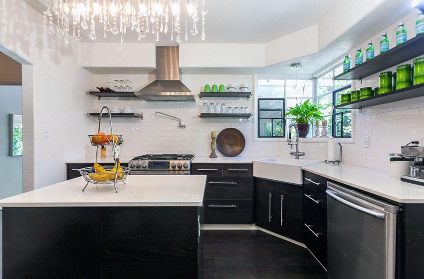 Kitchen with corner sink, cabinets in black and crystal chandelier