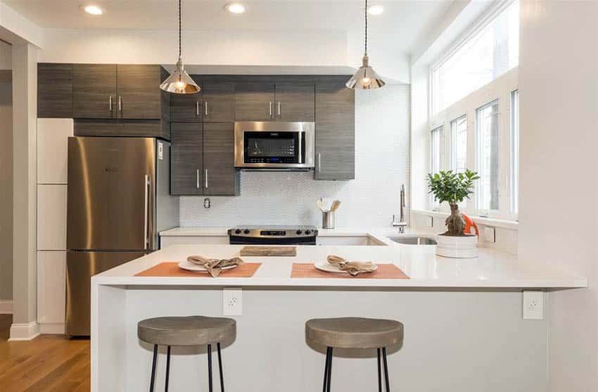 Contemporary kitchen with thassos quartz countertops and white mosaic backsplash
