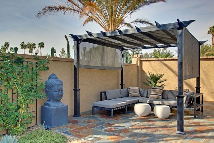 Contemporary stone slate patio with pergola and outdoor couch