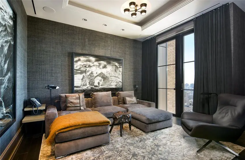 Dark decorated contemporary living room with black patterned walls and drapery