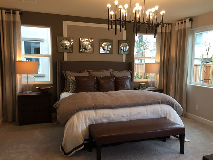 Decorated bedroom with tan and brown theme in new construction house