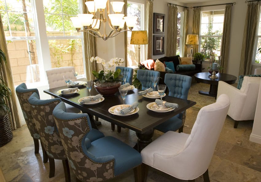 Dining room with blue chairs and white chairs