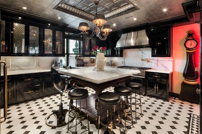 Eclectic kitchen with onyx black glass door cabinets and marble bevel edge countertops