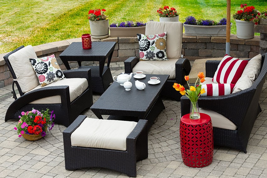 Furnished backyard paver patio with decorative circle design