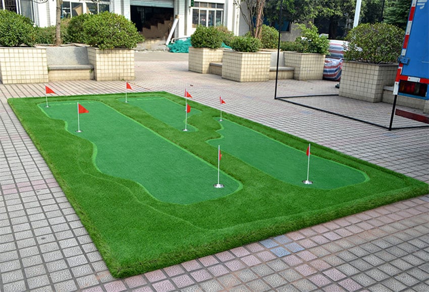 Large golf putting green in yard