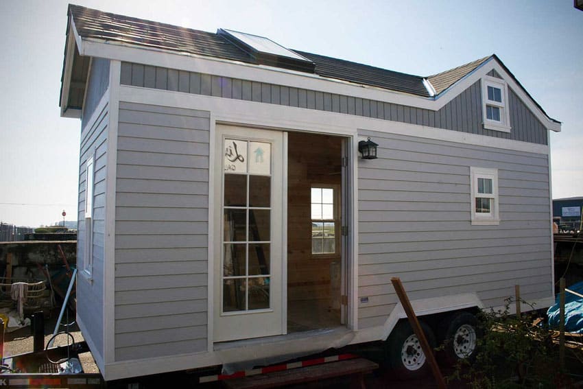 Gray painted tiny house on wheels