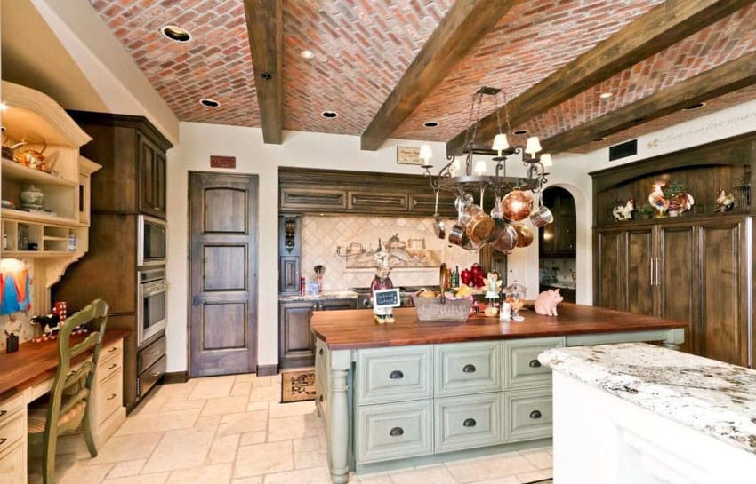 Kitchen with brick ceiling with exposed beams and rustic wood counter
