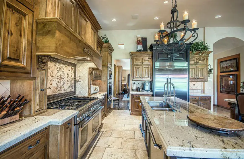 Kitchen with decorative backsplash, granite flooring and hickory wood cabinets
