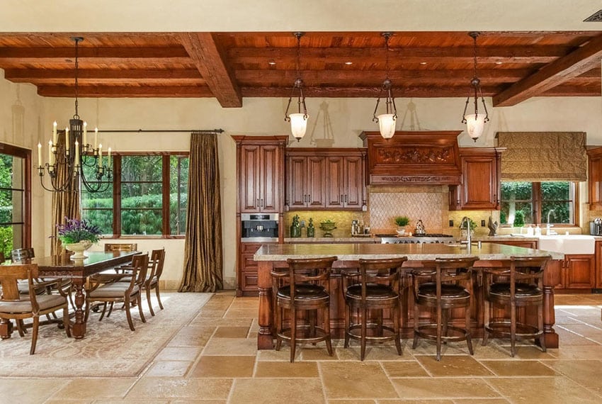 Italian style open concept kitchen with rustic wood beams