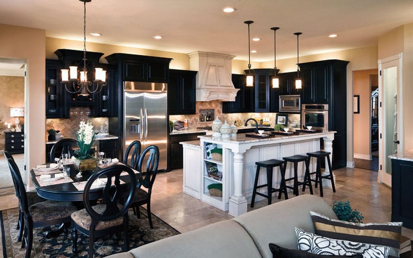 Kitchen with black cabinets and white island with open layout