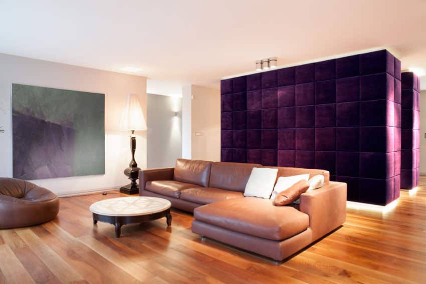 Living room with plush purple accent wall