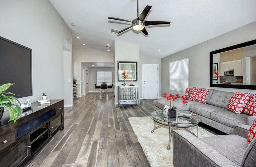 Living room with silver walls and hickory wood flooring