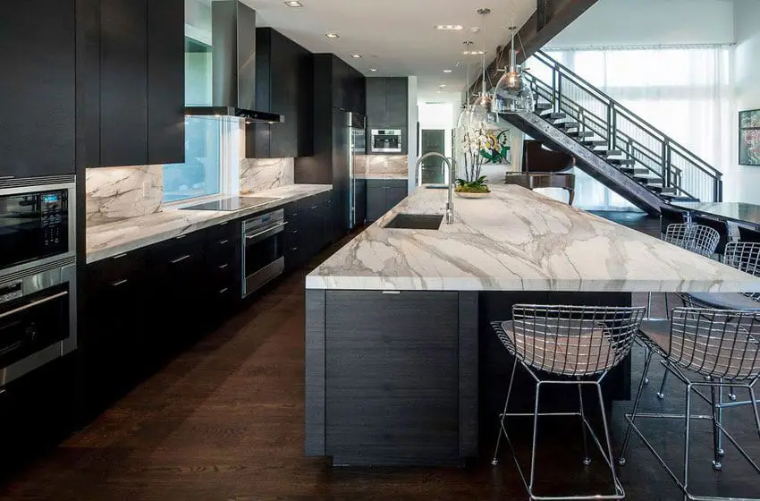 Luxury contemporary kitchen with black cabinets marble counter island
