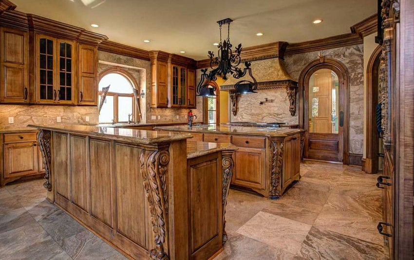 Kitchen chestnut cabinetry, carved motifs and granite backsplash