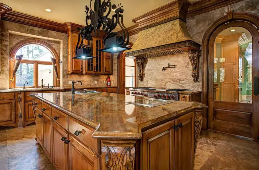 Kitchen with custom molding, arched window and black chandelier