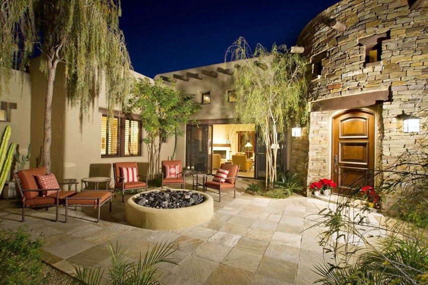 Mediterranean style patio with stucco firepit