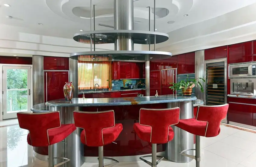 modern-kitchen-with-red-cabinets-and-gray-granite-counter-with-breakfast-bar-island
