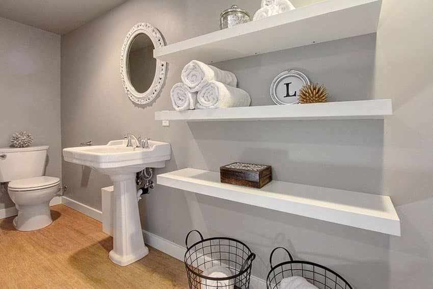 Narrow bathroom with open shelving and wire baskets