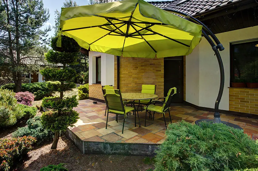 Raised slate patio with large umbrella shade