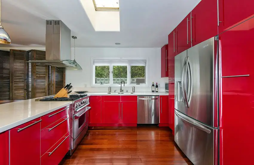 red-modern-kitchen-with-acrilux-cabinets-and-maple-flooring