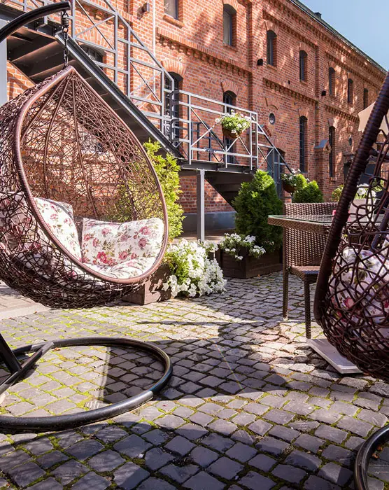 Cobblestones with outdoor swinging chairs