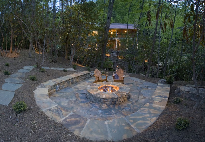 Stone patio with fire pit and stone circular bench seating