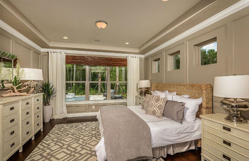 Tan bedroom with wood floors and beige furniture