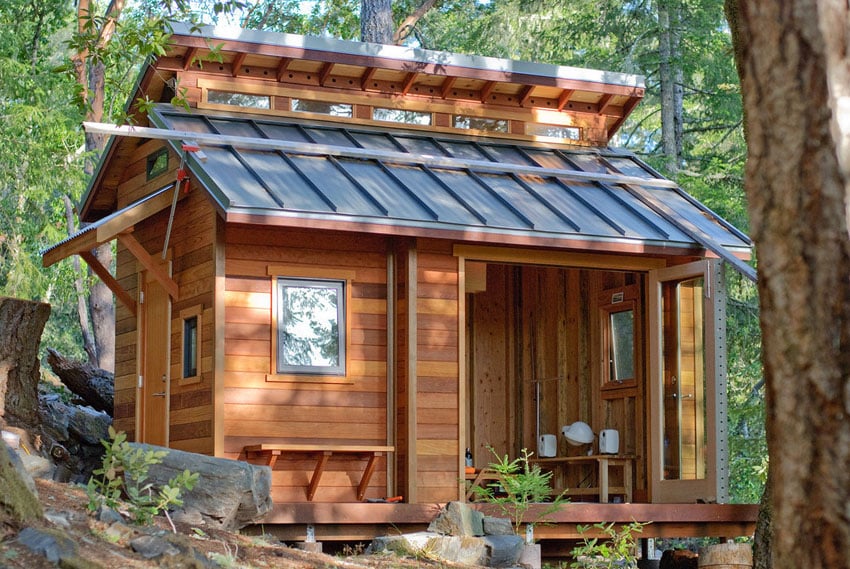 Tiny house with skylights and forest views