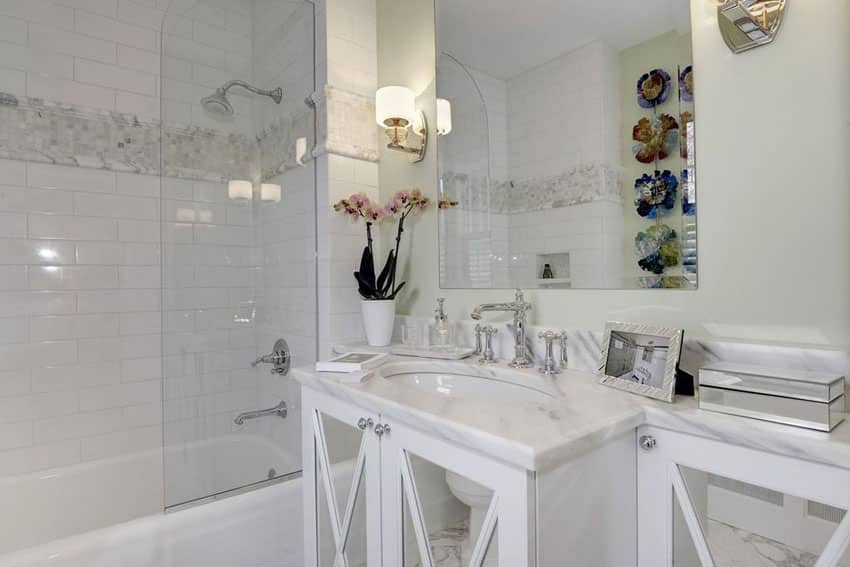 Traditional bathroom with white mirrored vanity and white tile