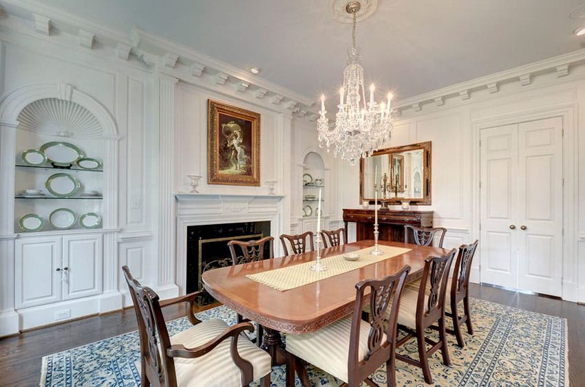 Traditional dining room with wood table and chairs on an area rug