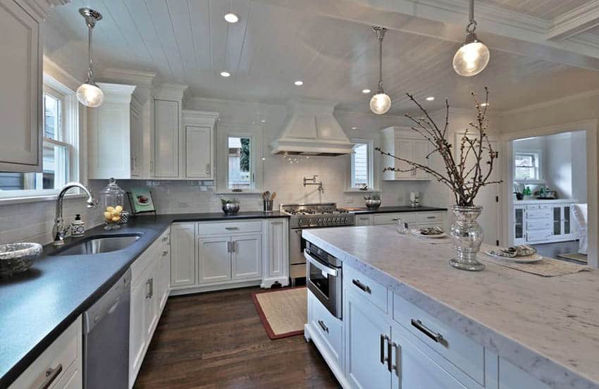 Traditional white kitchen with London gray quartz island and black quartz main countertops