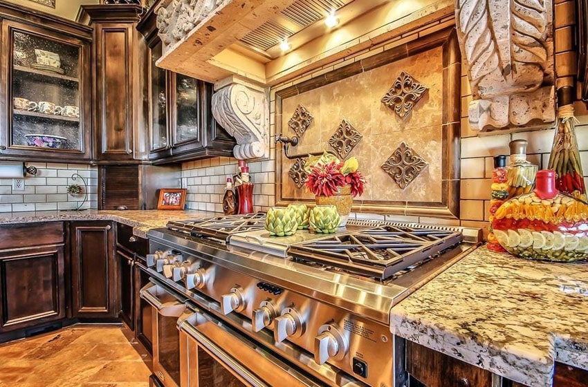 Tuscan style kitchen with dark cabinets and barricato granite counters