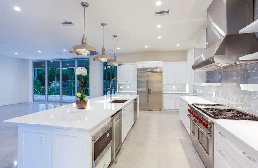 White cabinet kitchen with white quartz and gray glass subway tile backsplash