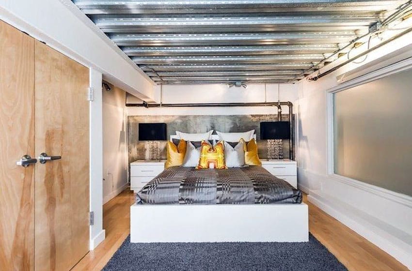 Bedroom loft with aluminum ceiling and light wood flooring