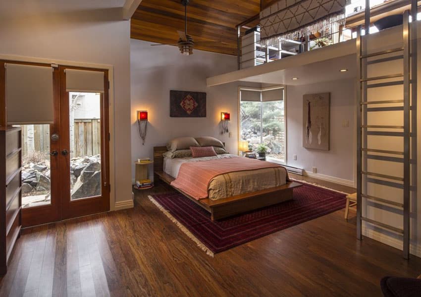 Contemporary loft bedroom with reverse floor plan, ladder and wood floors and ceilings